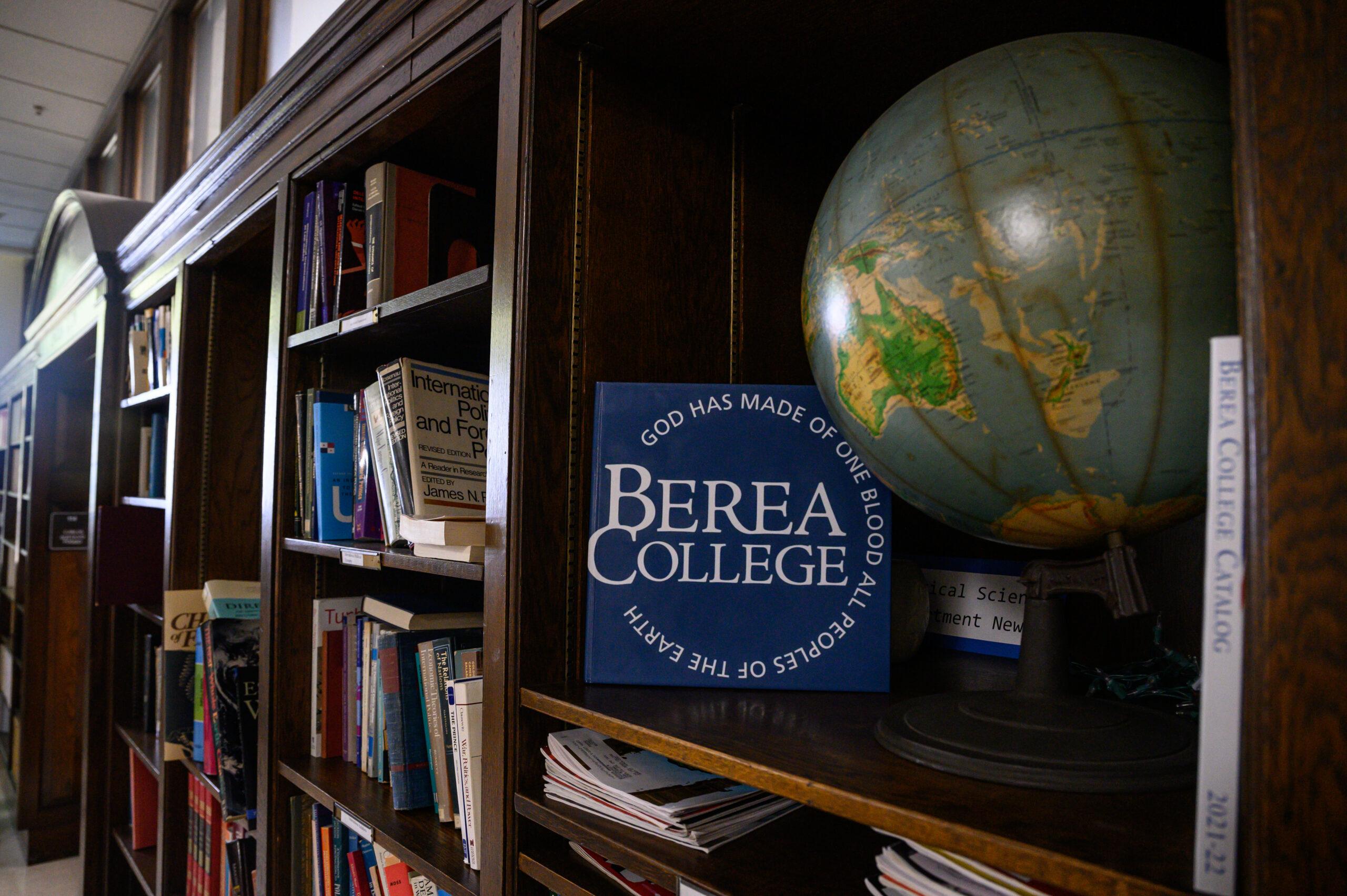 Picture of Bookshelf with Berea College logo and a globe
